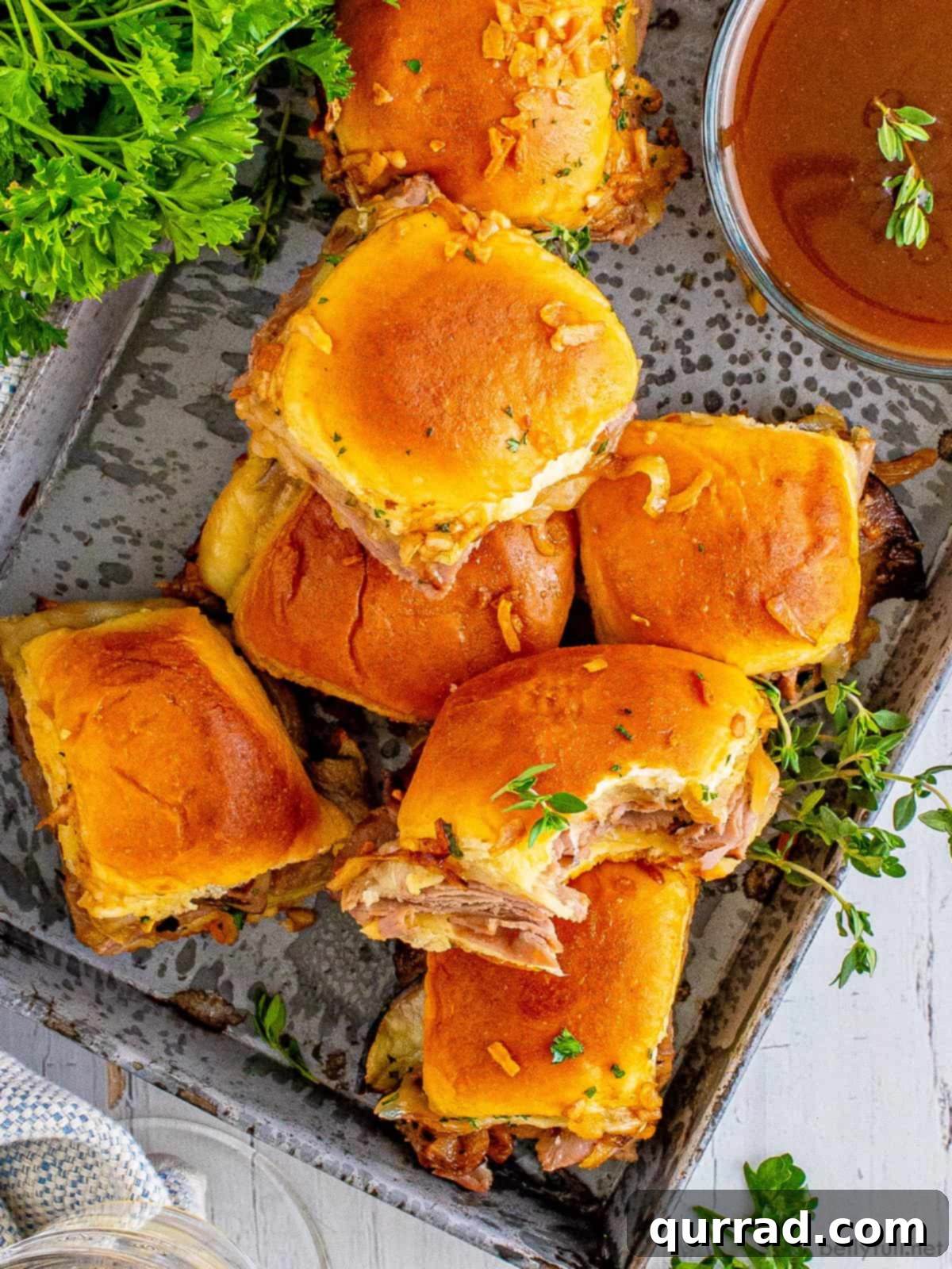 Irresistible French Dip Sliders 3 Overhead view of a platter full of French dip sliders