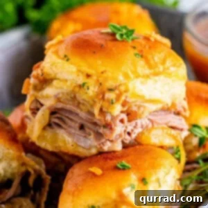 Irresistible French Dip Sliders 7 French dip sliders in a serving tray