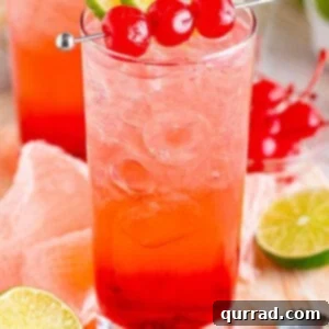 Dirty Shirley cocktail in a tall glass with 3 Maraschino cherries