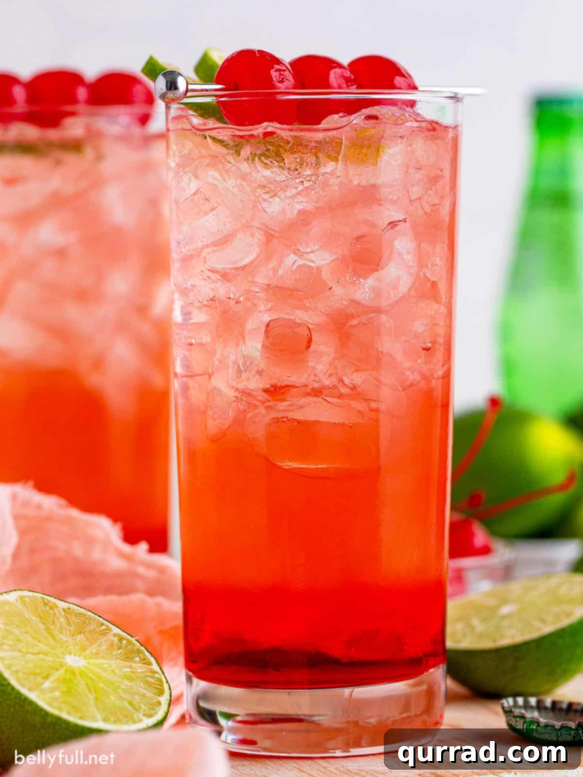 Tipsy Temple 5 Dirty Shirley cocktail in a tall glass with 3 Maraschino cherries, ready to be enjoyed