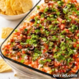 Overhead view of 7 layer dip in a casserole dish