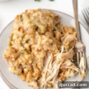 Crockpot chicken and stuffing on a white plate, ready to be served