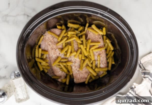 Green beans added over chicken breasts in crockpot