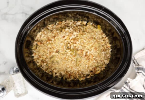 Dry stuffing mix layered over green beans and chicken in crockpot