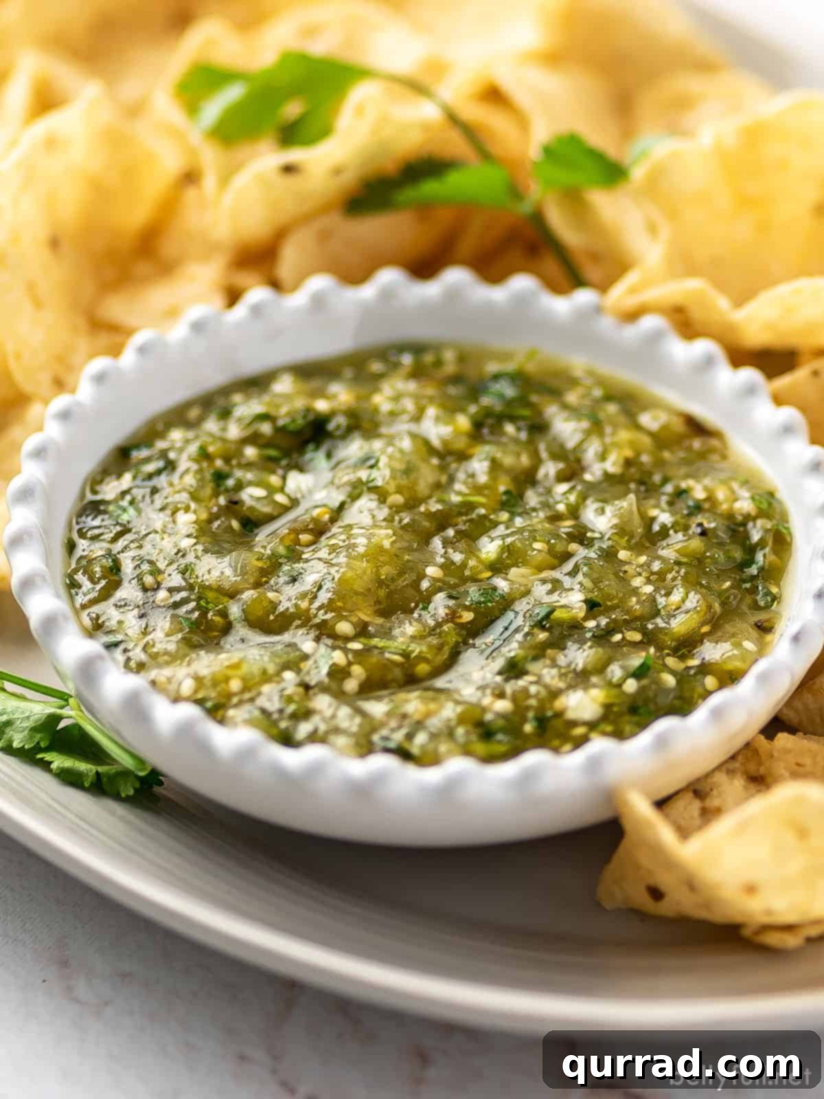 Angled view of a white bowl of salsa verde