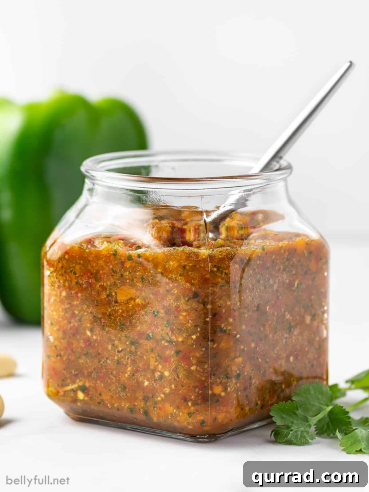 The Flavorful Foundation 2 A beautiful glass jar filled with vibrant green Puerto Rican Sofrito, ready to infuse flavor into any dish.