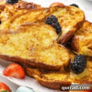 Decadent Challah French Toast 3 Delicious Challah French Toast, golden brown and ready to be served.