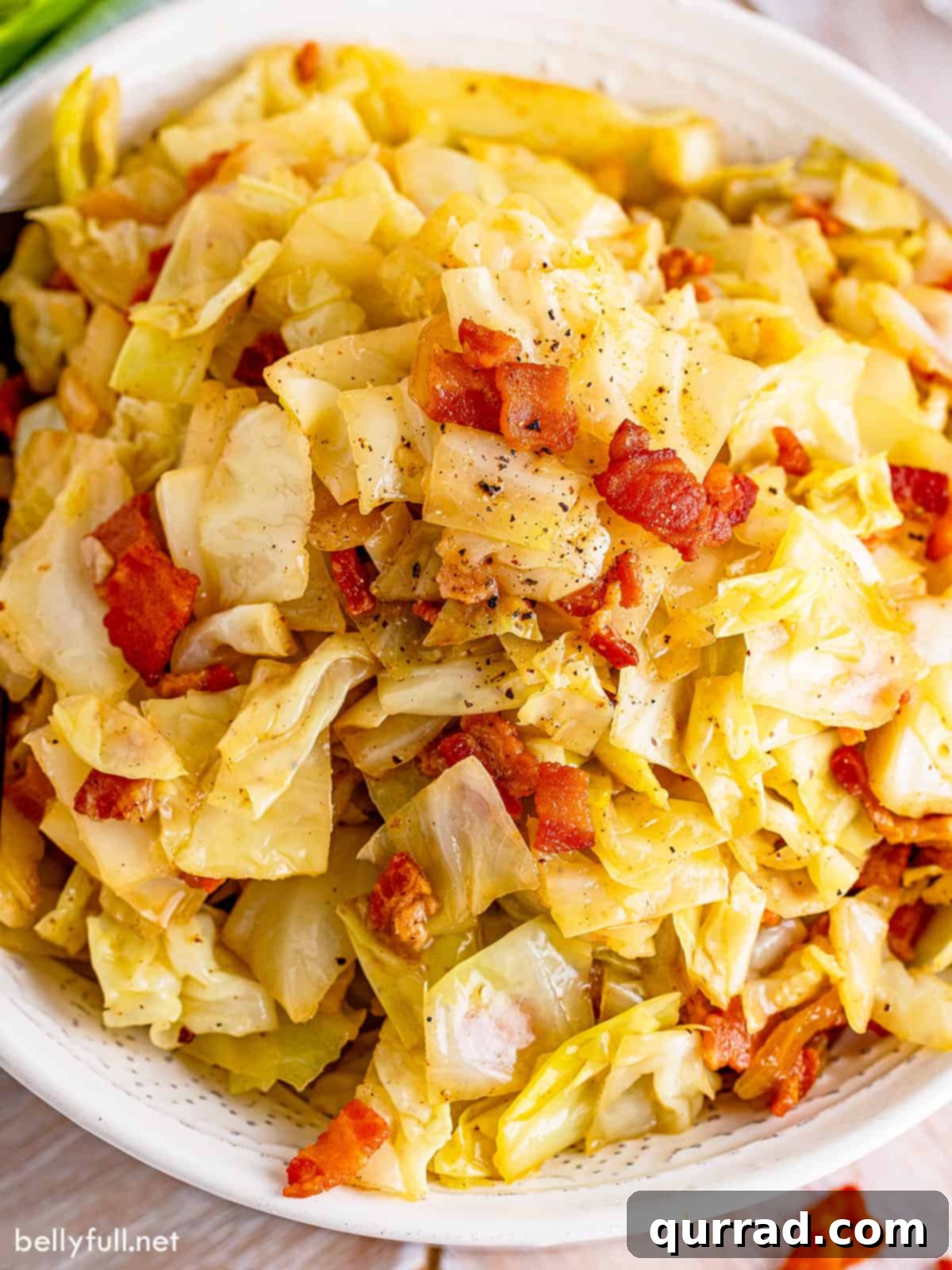 Golden Skillet Cabbage 5 Close-up of a serving of fried cabbage with bacon