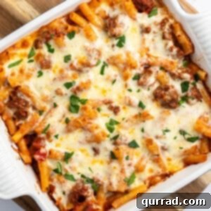 Overhead view of baked ziti in a square casserole dish
