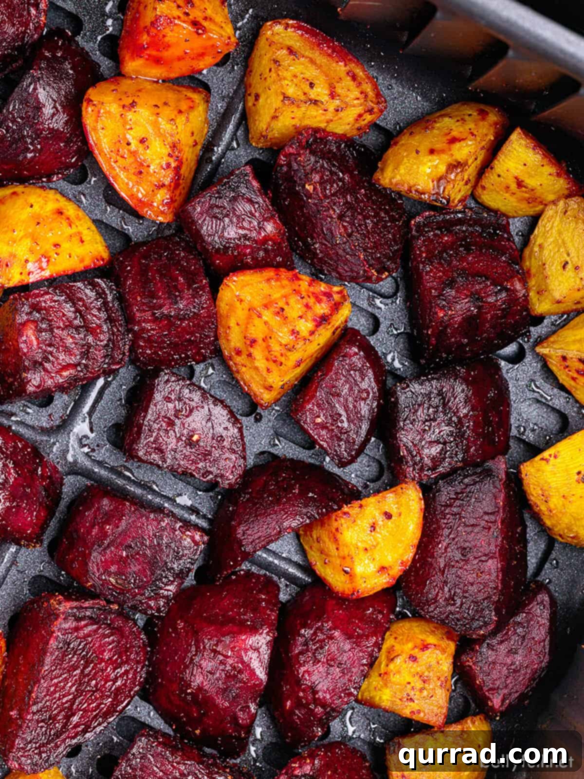 Crispy Air-Fried Beet Bites 2 Close up shot of vibrant red and golden air fryer beets, showcasing their tender texture and appealing colors.