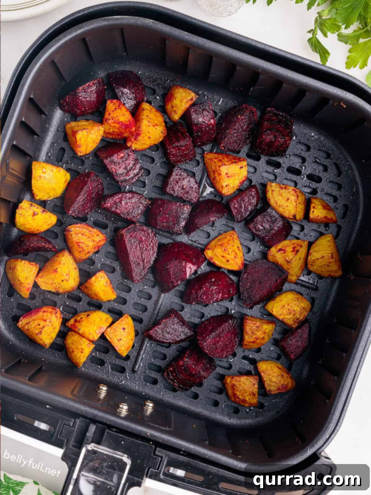 Crispy Air-Fried Beet Bites 3 Cubes of red and golden beets perfectly arranged in an air fryer basket, ready for cooking.