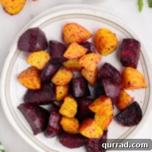Cubes of air fryer beets on a white plate