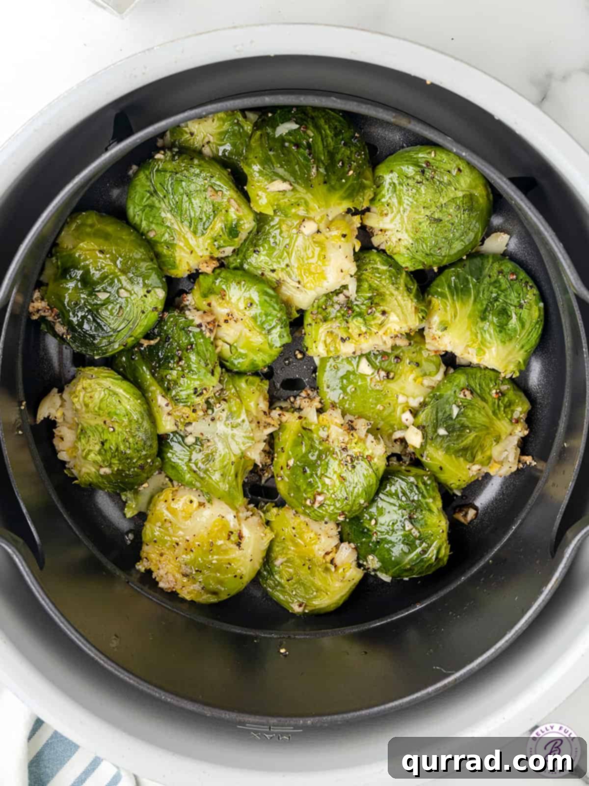 Overhead view of smashed brussels sprouts in the air fryer