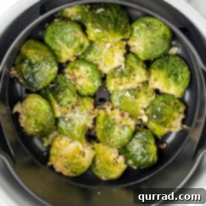 Overhead view of smashed brussels sprouts in the air fryer