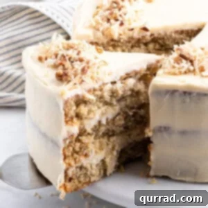 A slice being served from a hummingbird layer cake