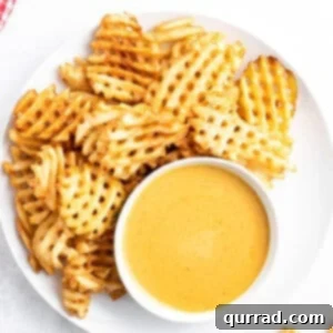 Homemade Chick-fil-A Style Sauce 3 Overhead view of chick-fil-a sauce on a plate with waffle fries