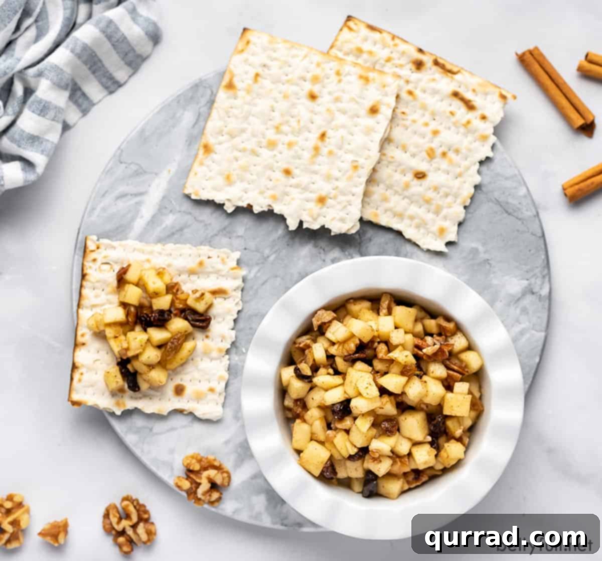 Sweet Paste of Passover 5 A warm, inviting overhead view of a bowl of Charoset next to crunchy matzo, perfectly arranged for a Passover celebration.