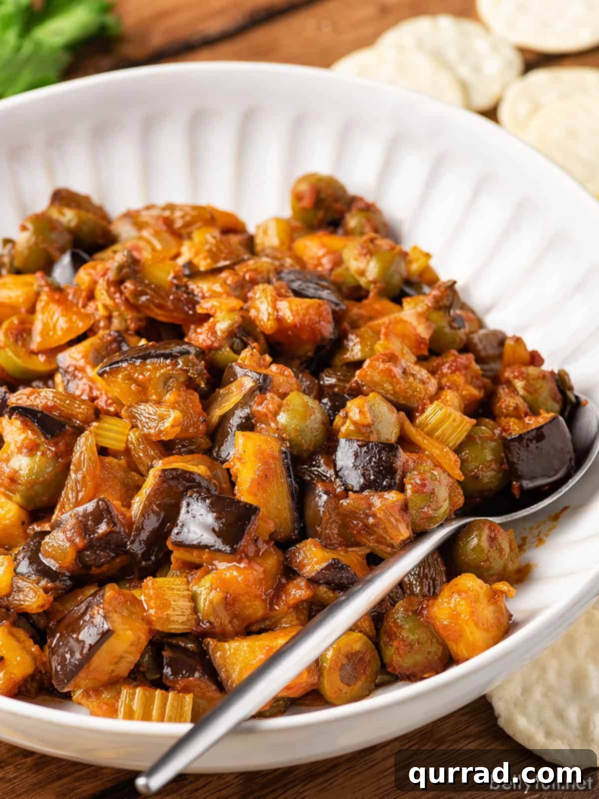 eggplant relish in bowl with spoon