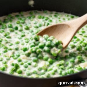 Creamy Braised Peas 6 Creamed peas close-up in a pan