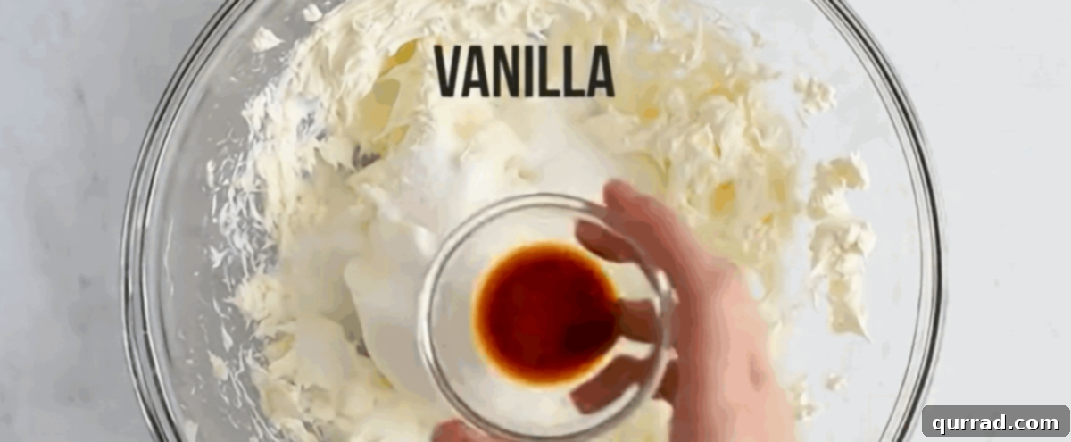 Combining the ingredients for the dressing: cream cheese, sour cream, sugar, and vanilla.