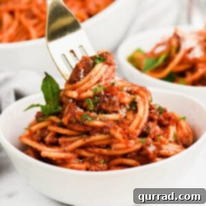 Quick Instant Pot Spaghetti 2 A fork twirling noodles in a bowl of spaghetti and meat sauce