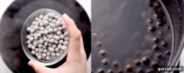 uncooked black tapioca pearls simmering in water