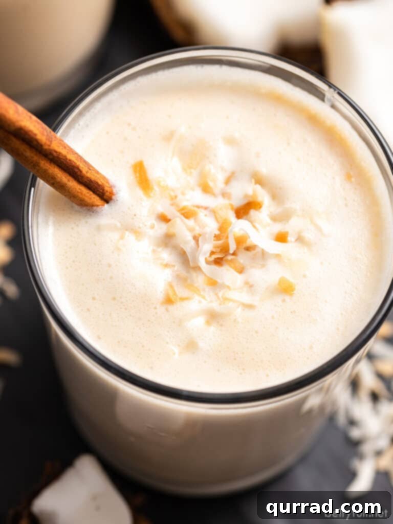 Puerto Rico's Tropical Eggnog Coquito 2 Angled overhead view of a glass of coquito