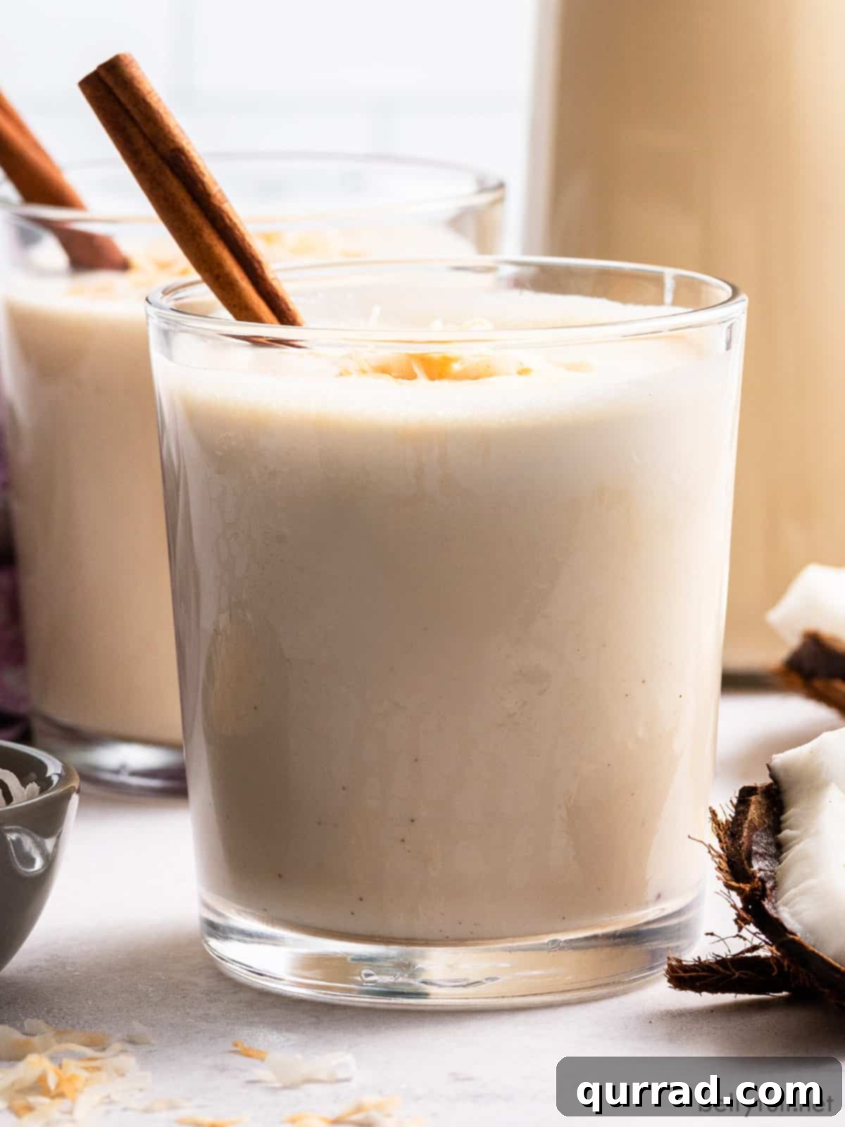 Puerto Rico's Tropical Eggnog Coquito 3 Side view of a glass of coquito
