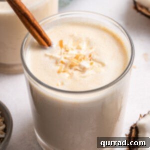 Puerto Rico's Tropical Eggnog Coquito 6 Angled view of a glass of coquito