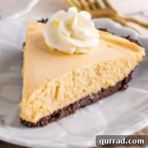 A slice of peanut butter pie topped with whipped cream