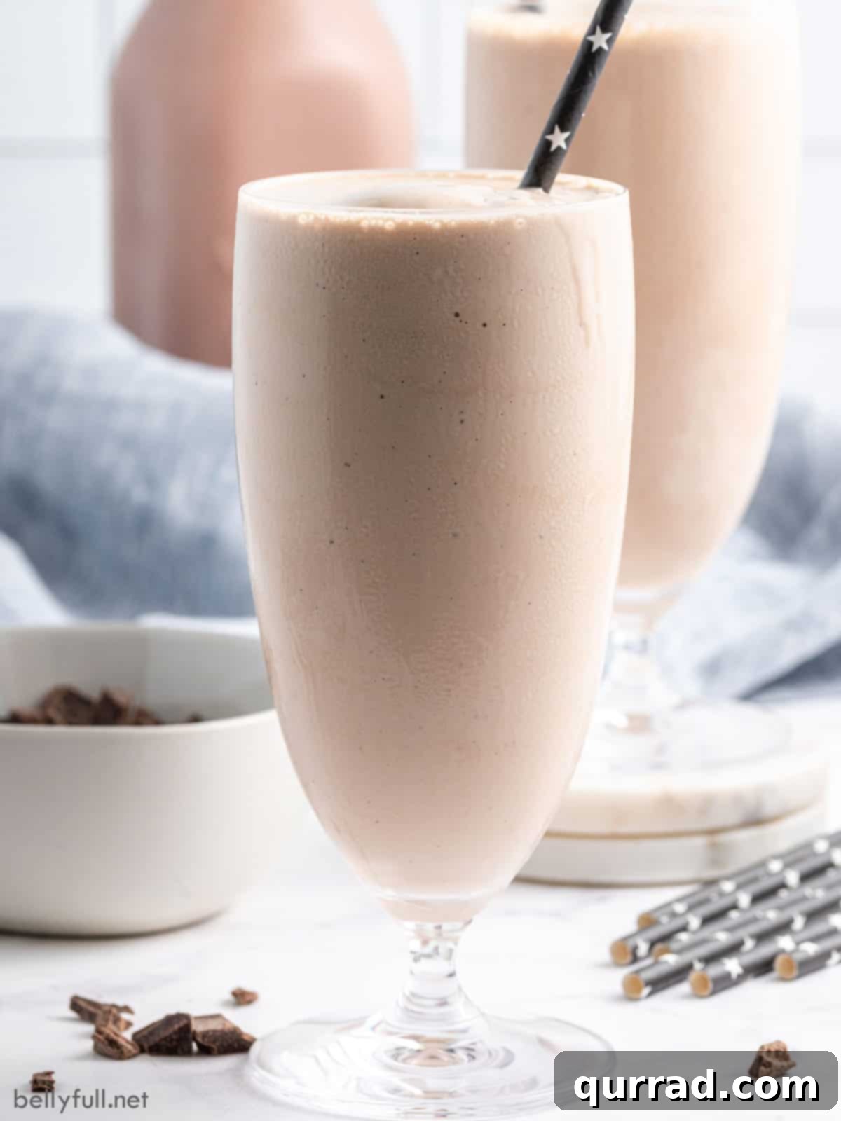 A close-up of a homemade Wendy's chocolate frosty in a glass, showcasing its rich, creamy texture and perfect consistency.