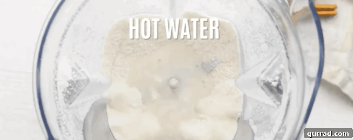 Creamy Cinnamon Mexican Horchata 4 Blending rice with hot water in a blender.