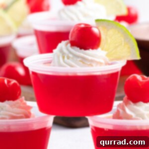Tipsy Shirley Gel Bites 6 Dirty Shirley Temple Jello shot with whipped cream, cherry, and lime garnish