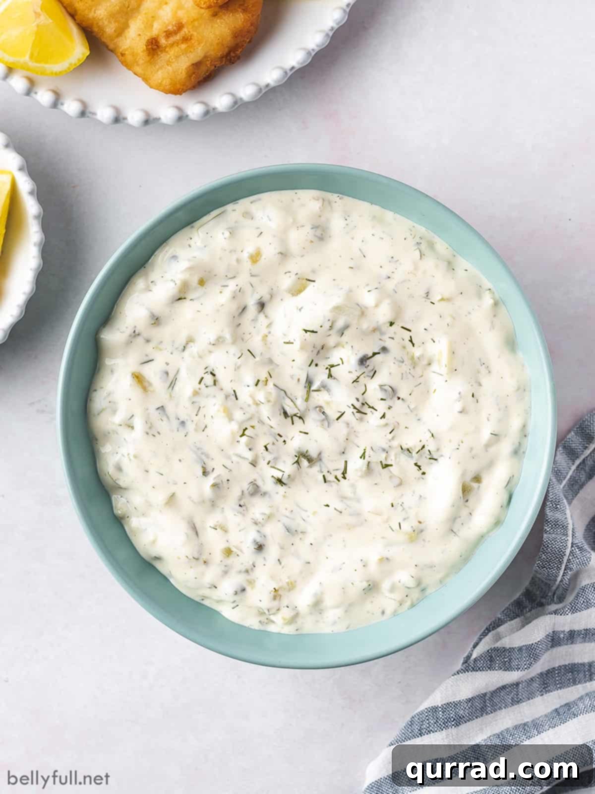 Zesty Fish Dip 3 Overhead view of a beautiful blue bowl filled with freshly made homemade tartar sauce
