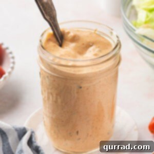 A spoon in a jar of homemade Thousand Island Dressing, ready to be served