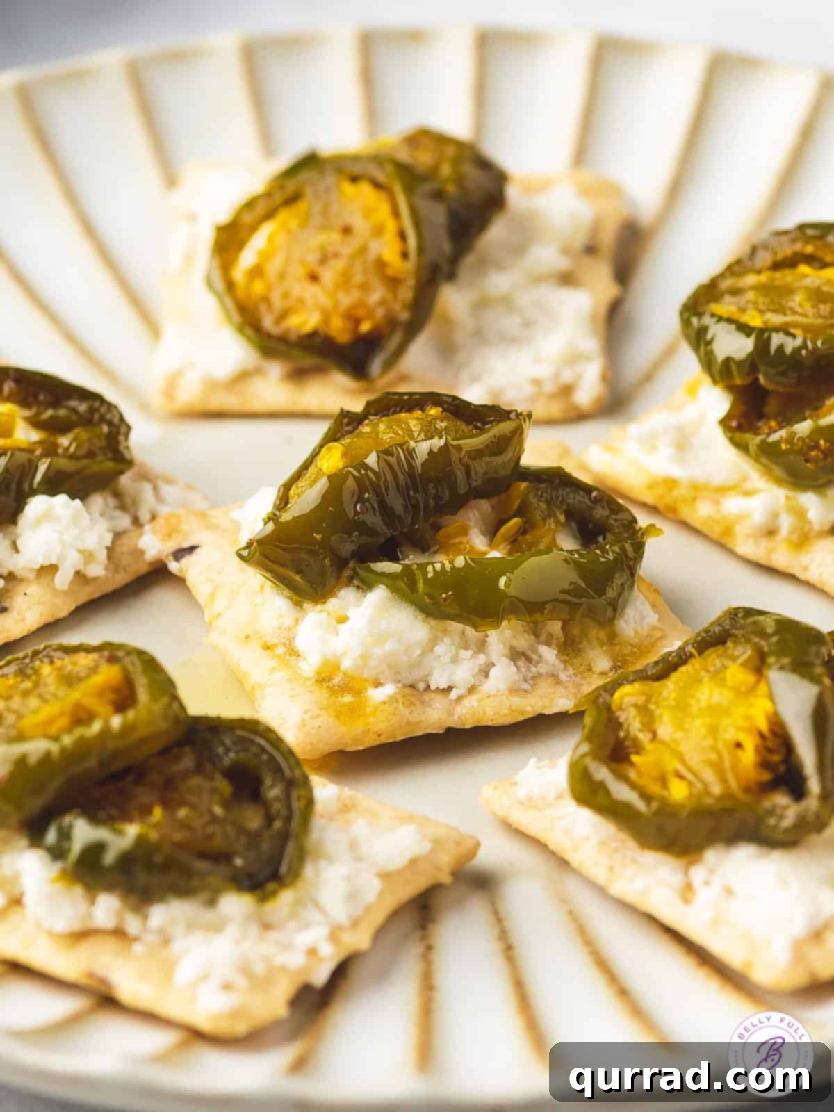 Cowboy Candy 10 Cowboy candy served on crackers with cream cheese, a popular appetizer option.