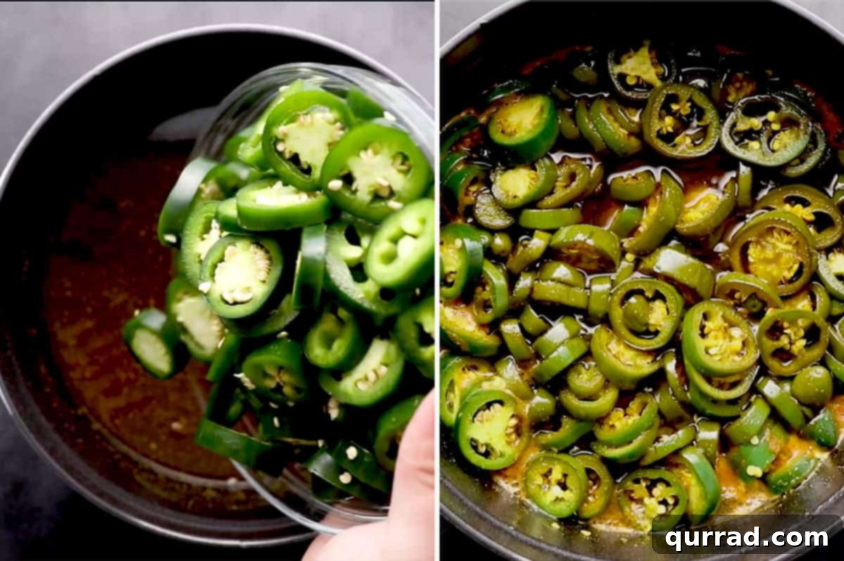 Cowboy Candy 6 Sliced jalapeños simmering in the sweet and spicy brine in a large pot.