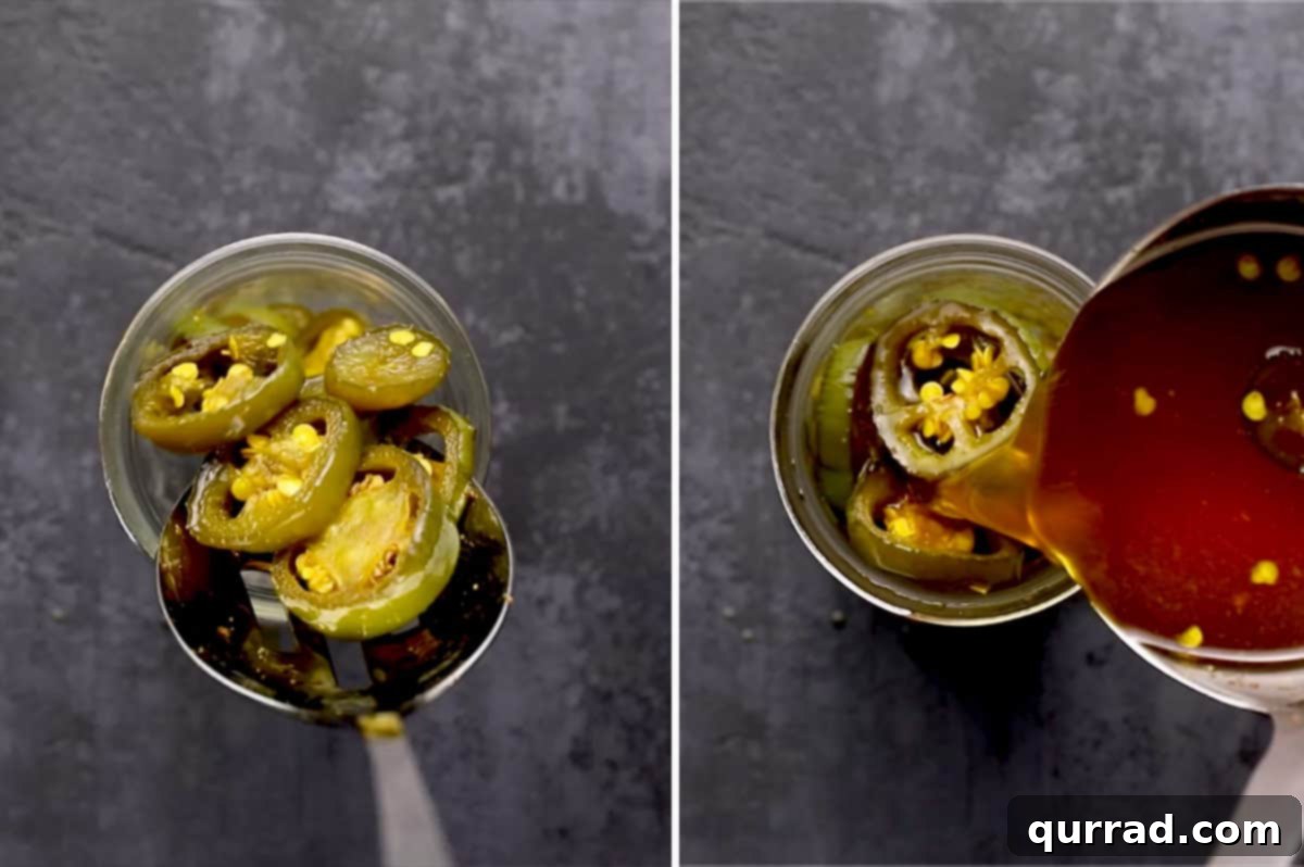 Cowboy Candy 7 Candied Jalapeños being carefully spooned into a clean glass canning jar.