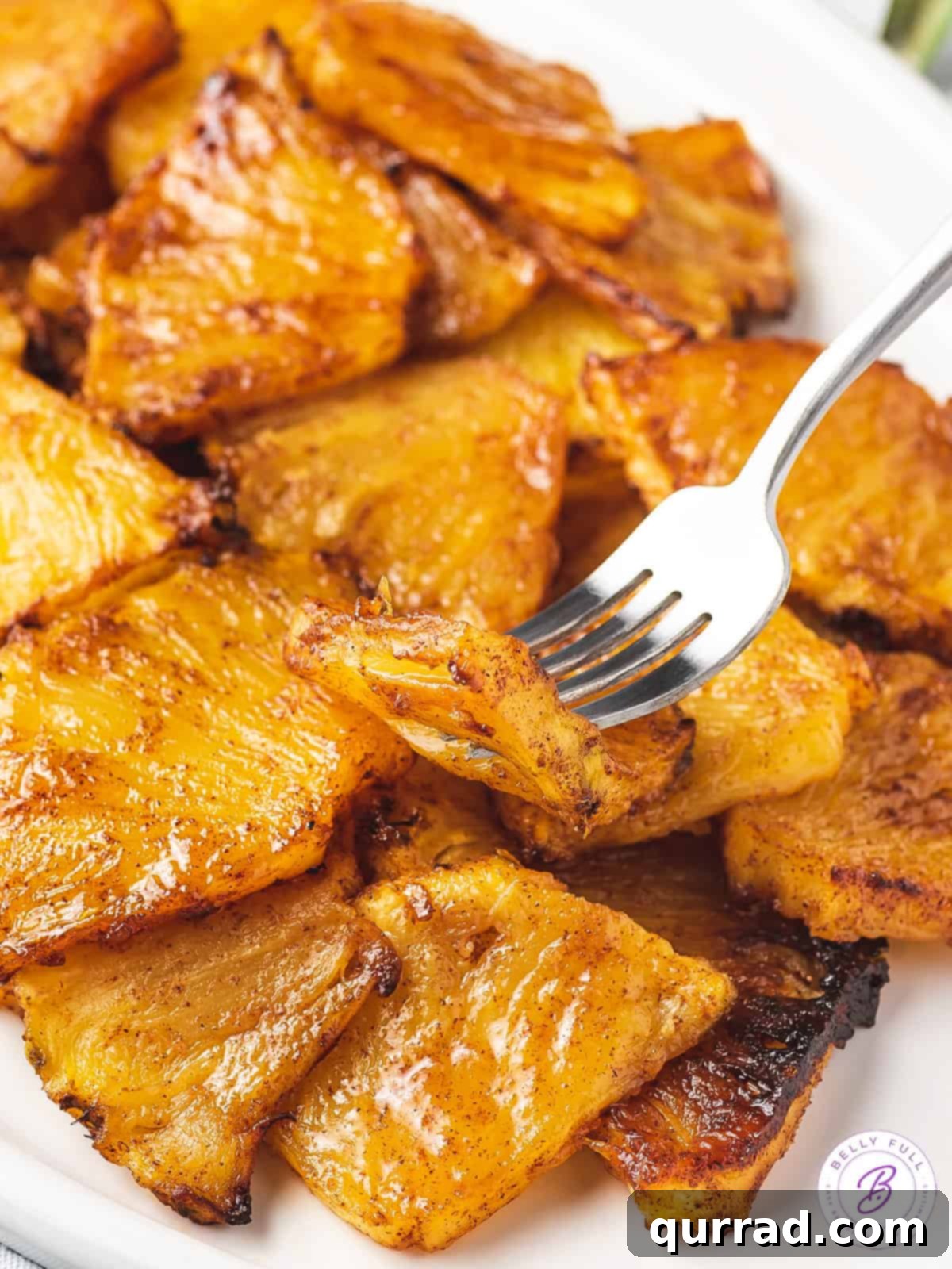 Caramelized Air Fryer Pineapple 8 close up caramelized pineapple on fork