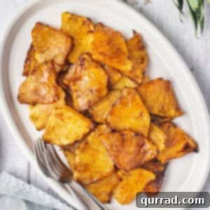 overhead white plate of air fryer pineapple pieces