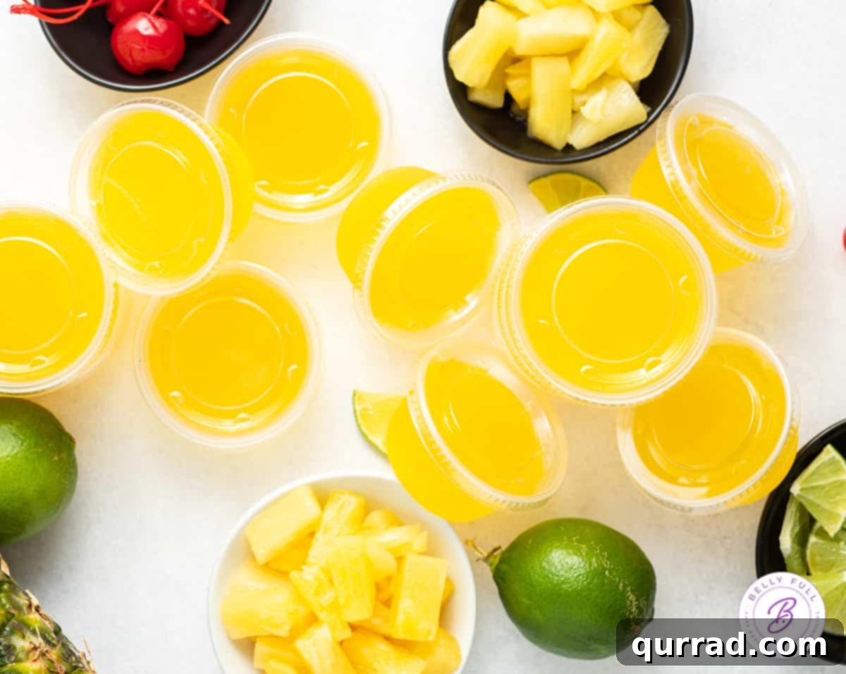Island Escape Mai Tai Jellies 3 overhead pile of pineapple jello shots with lids