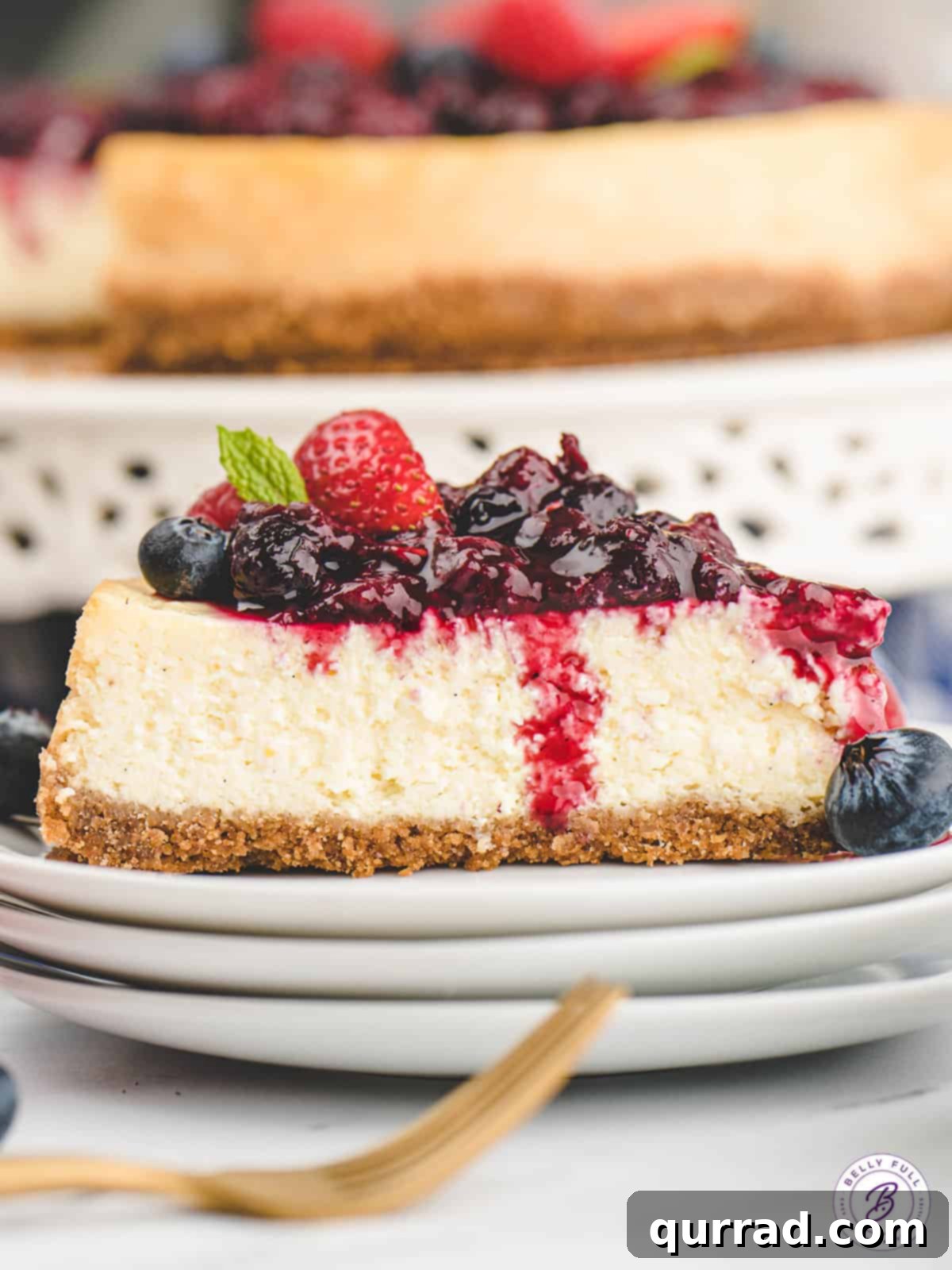 Flawless Instant Pot Cheesecake 2 A slice of vanilla bean cheesecake topped with berry compote