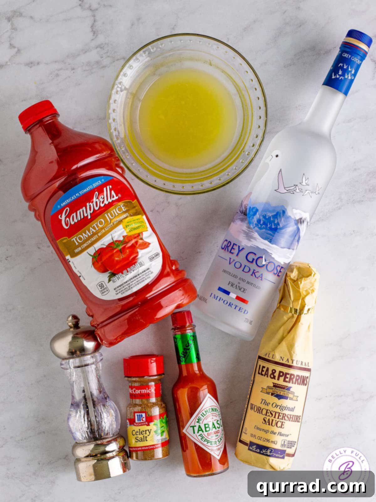 Say Her Name Thrice 3 An inviting assortment of Bloody Mary garnishes spread out on a wooden table, featuring fresh celery, bright lemons, green olives, and juicy cherry tomatoes, ready for customization.