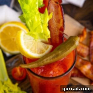 Say Her Name Thrice 7 Overhead view of a Bloody Mary garnished with lemon, celery, and bacon