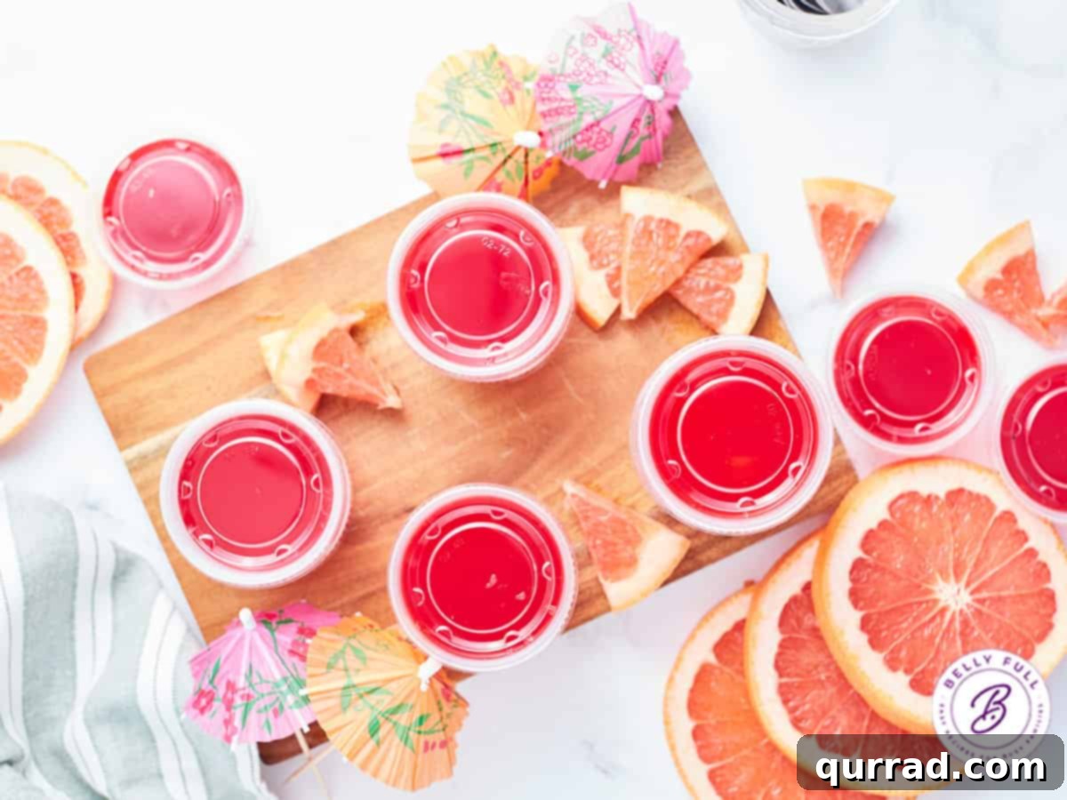 Ocean Mist Shooters 3 Overhead view of several Sea Breeze Jello Shots garnished with fresh grapefruit wedges.
