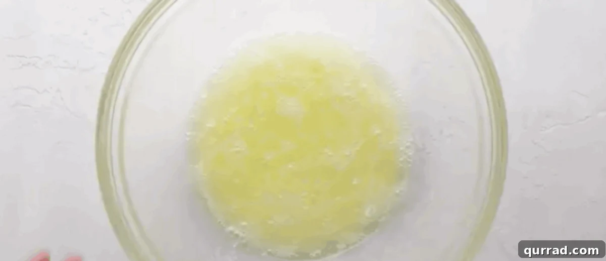 Ruby Raspberry Kisses 2 Egg whites and sugar in a heatproof bowl, ready for whisking over a water bath.