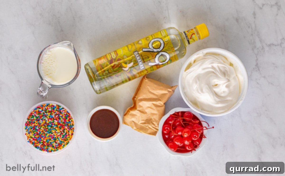 The four core ingredients for these delightful pudding shots. An overhead shot showcasing the simple ingredients for Banana Split Pudding Shots: instant vanilla pudding mix, whole milk, banana liqueur, and whipped topping.