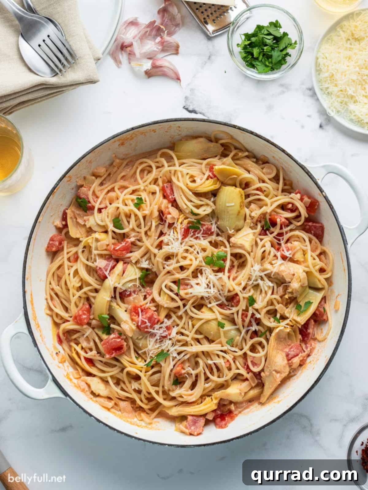 Artichoke pasta in white pan overhead picture