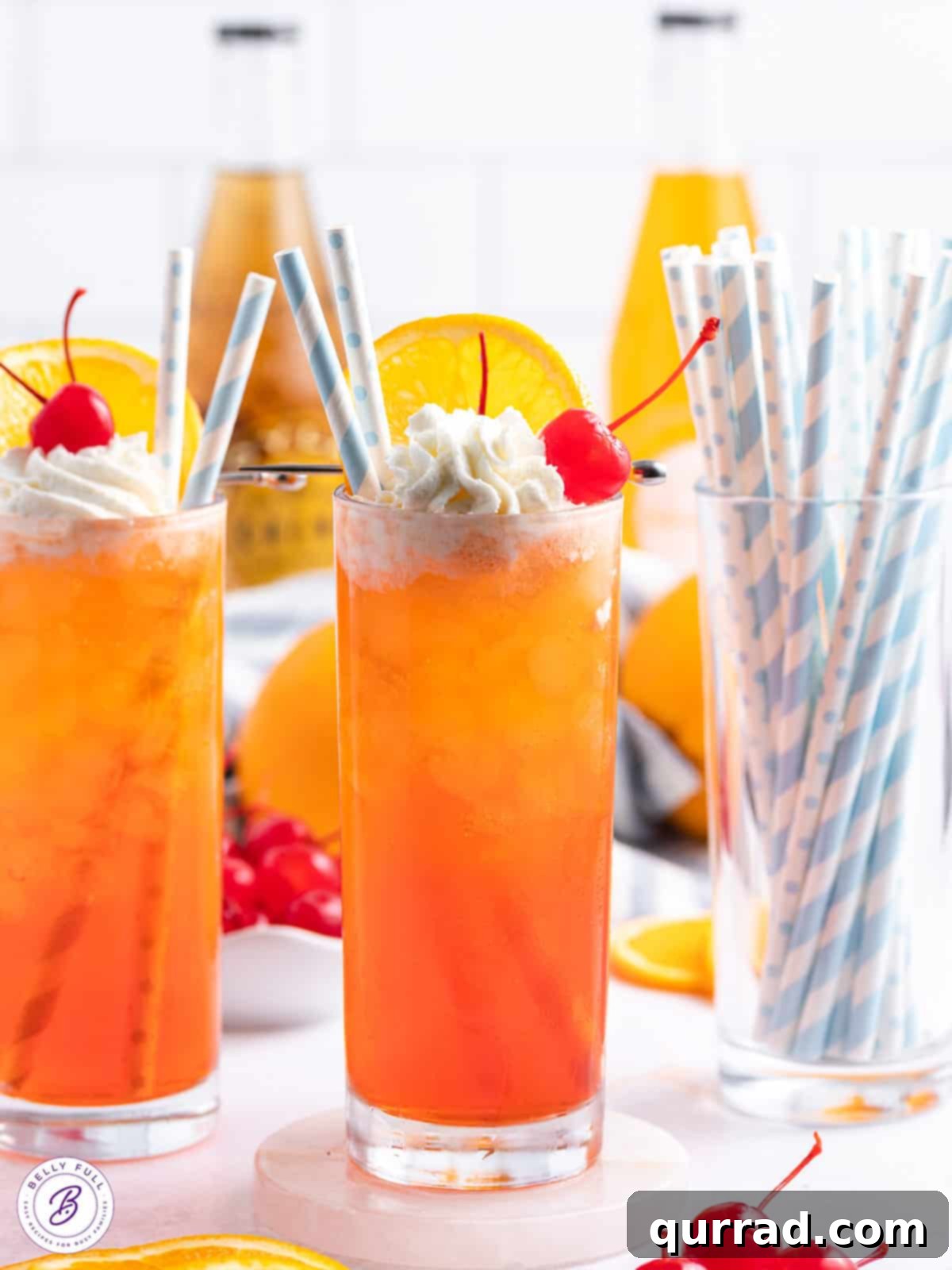 Orange Creamsicle Drink with whipped cream and striped straws