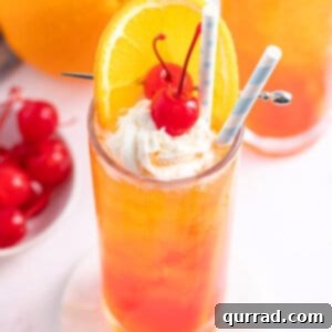 Orange Creamsicle Shirley Temple with whipped cream and a cherry
